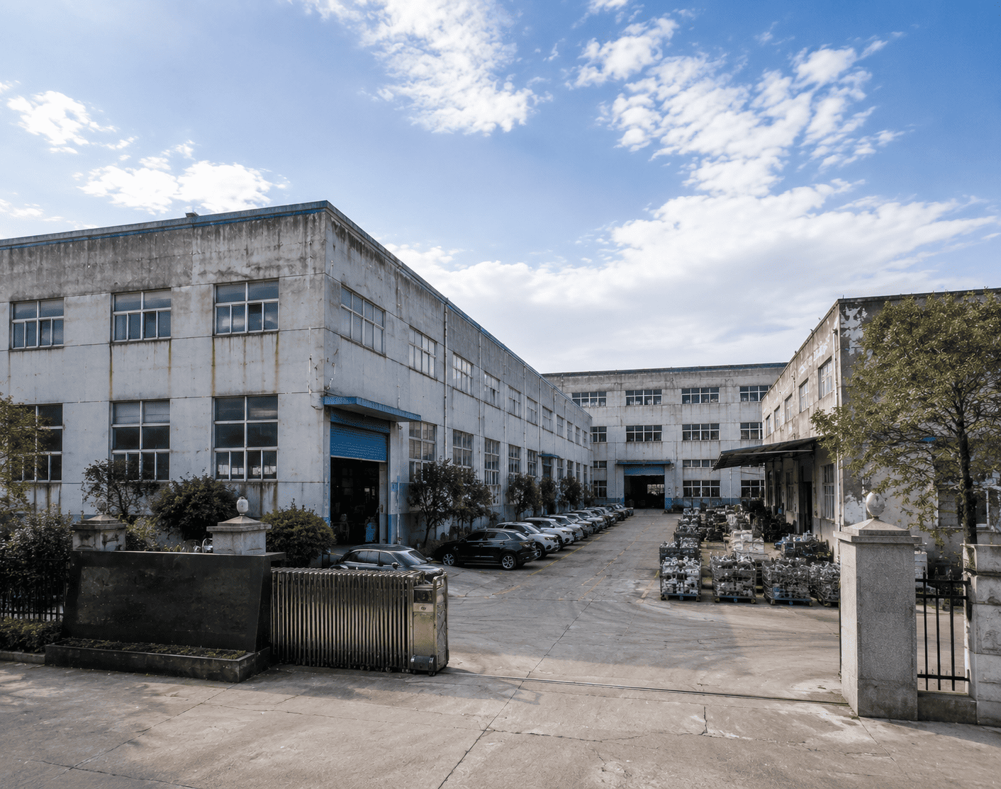 Exterior view of the brake caliper manufacturing facility with industrial loading area